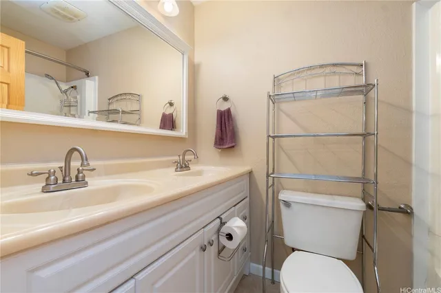 a bathroom with a sin sink and toilet