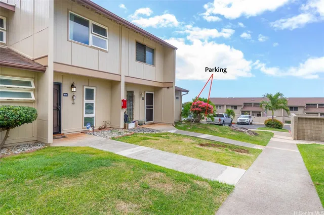 a front view of house with yard and entertaining space