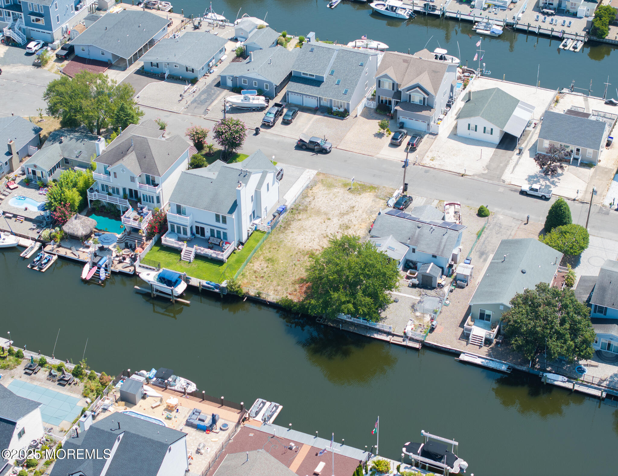 28 Commodore Drive Brick, NJ 08723 - Photo 7 of 9 an aerial view of a house with a lake view