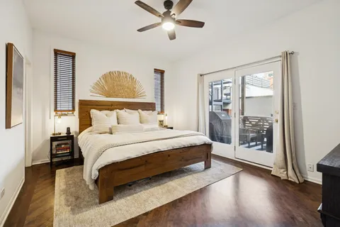 a bedroom with a large bed and a window