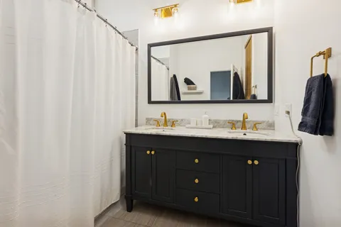 a bathroom with a sink and mirror