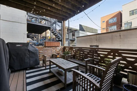 a stove top oven sitting inside of a kitchen