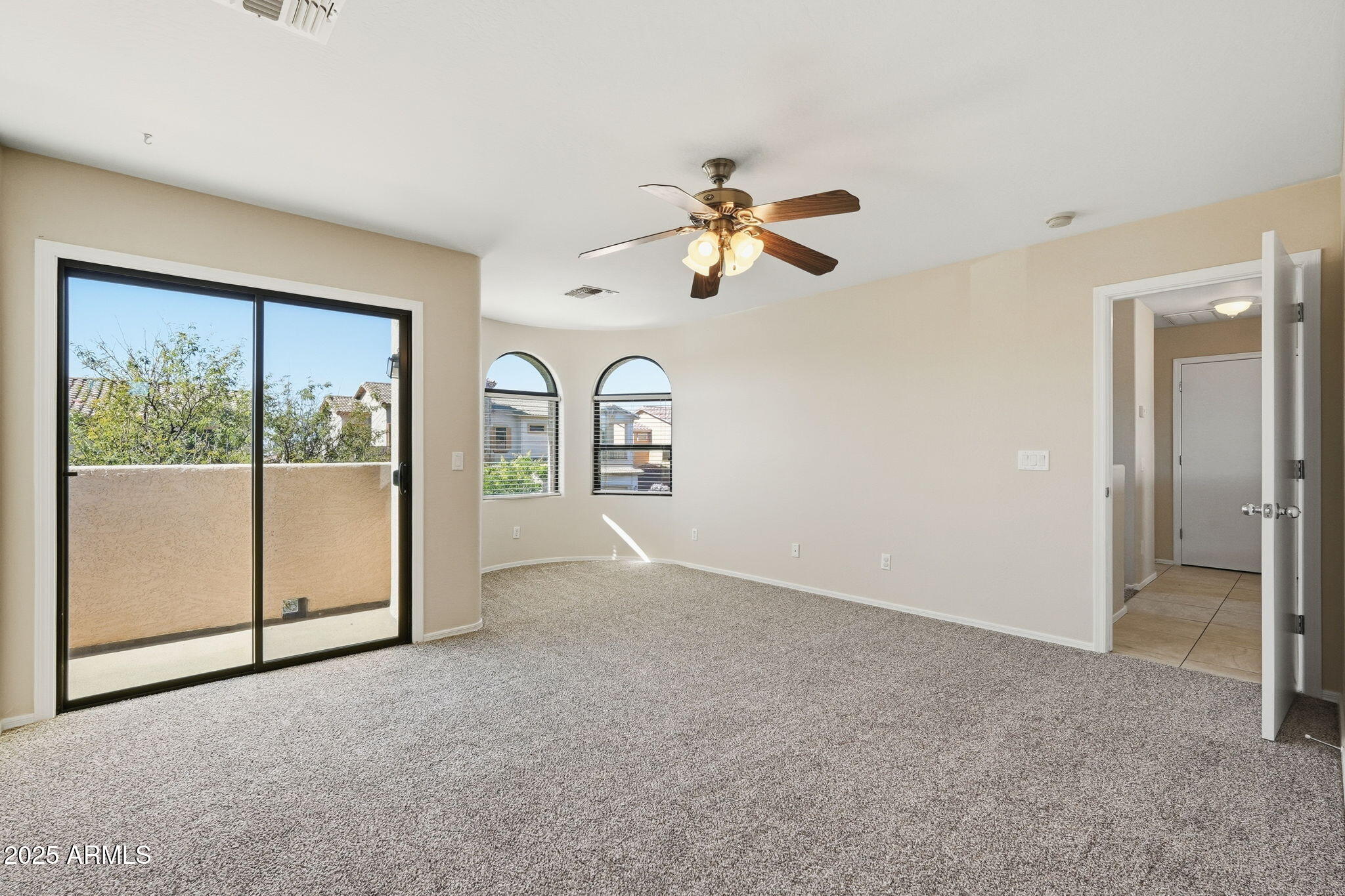 2691 South Chaparral Road Apache Junction, AZ 85119 - Photo 18 of 43 an empty room with fan and windows