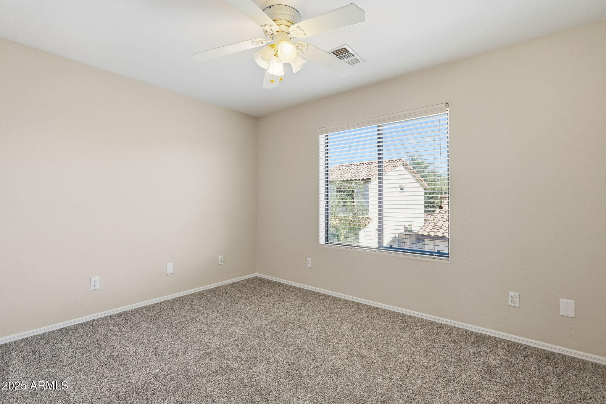 2691 South Chaparral Road Apache Junction, AZ 85119 - Photo 21 of 43 an empty room with a window