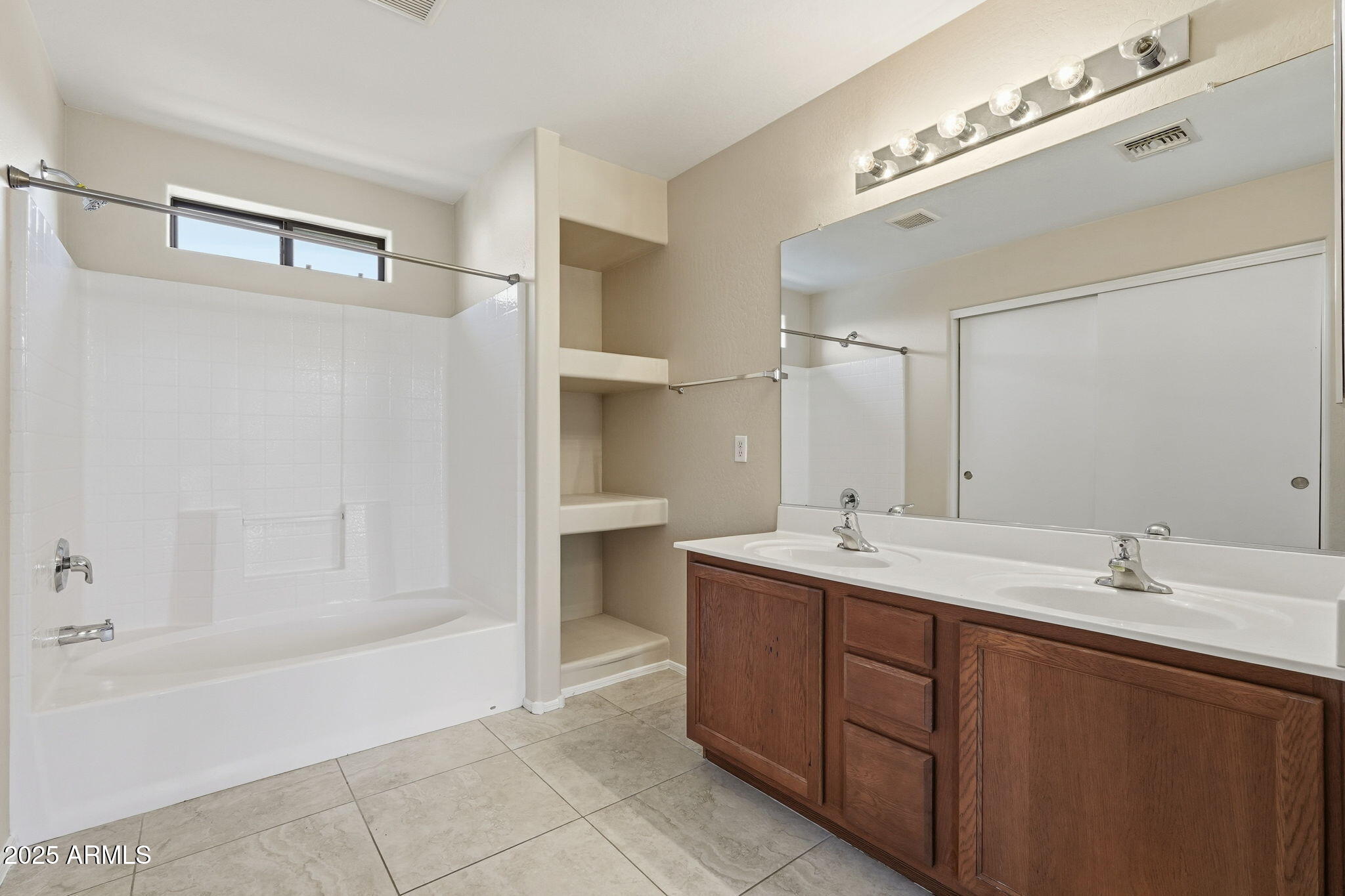 2691 South Chaparral Road Apache Junction, AZ 85119 - Photo 31 of 43 a bathroom with a tub sink and mirror