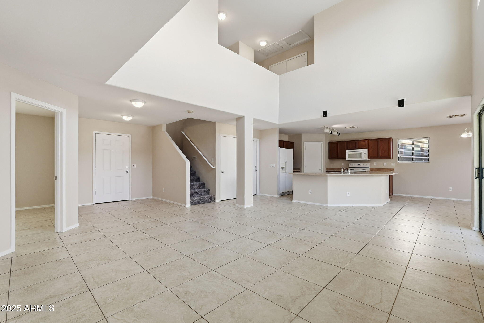2691 South Chaparral Road Apache Junction, AZ 85119 - Photo 8 of 43 a view of a kitchen with furniture and an empty room
