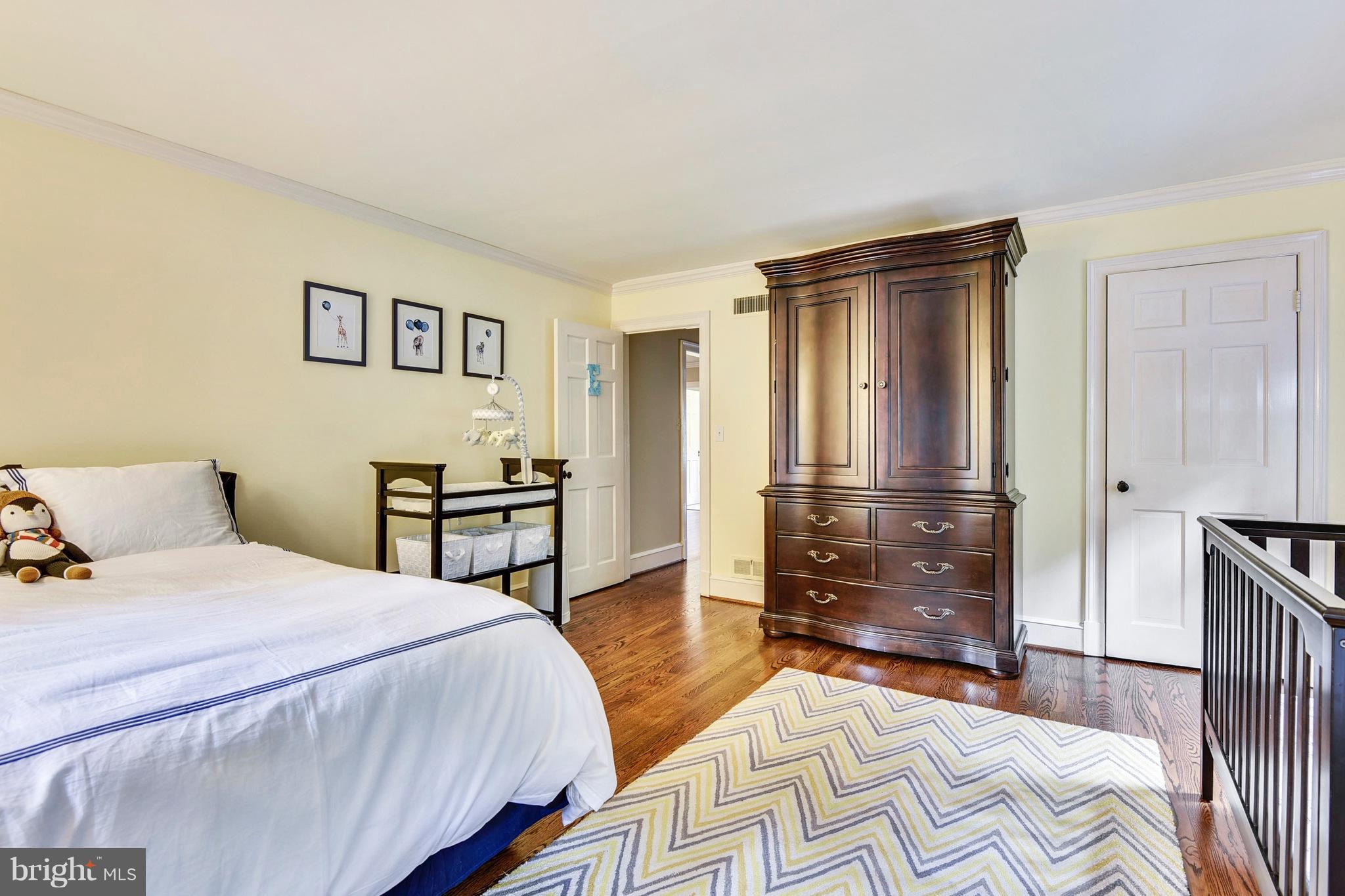 15 Edgevale Road Baltimore, MD 21210 - Photo 22 of 30 a bedroom with a bed and wooden floor