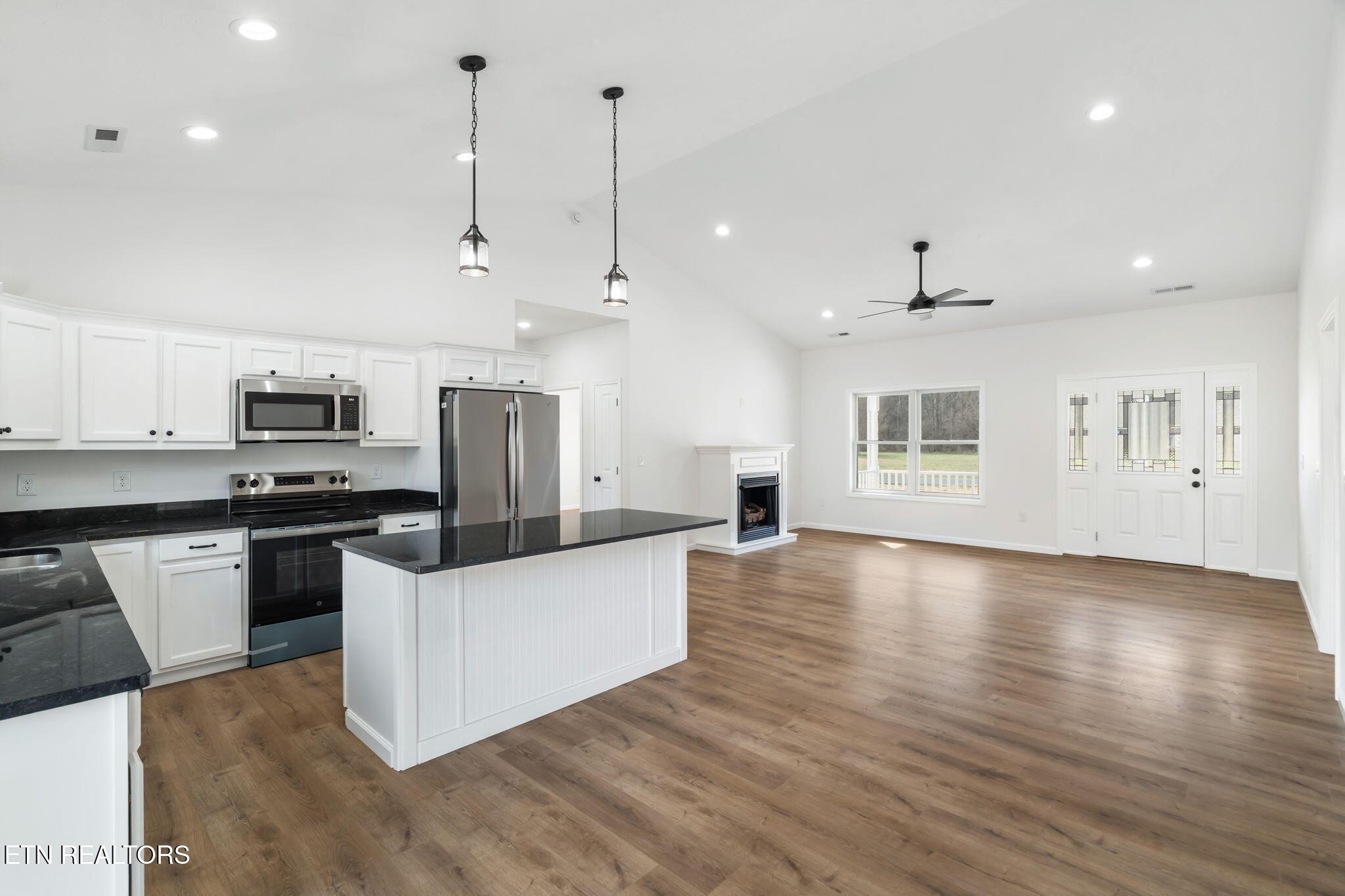 680 Kaylee Lane Del Rio, TN 37727 - Photo 11 of 41 a kitchen with stainless steel appliances granite countertop a sink a stove and a refrigerator
