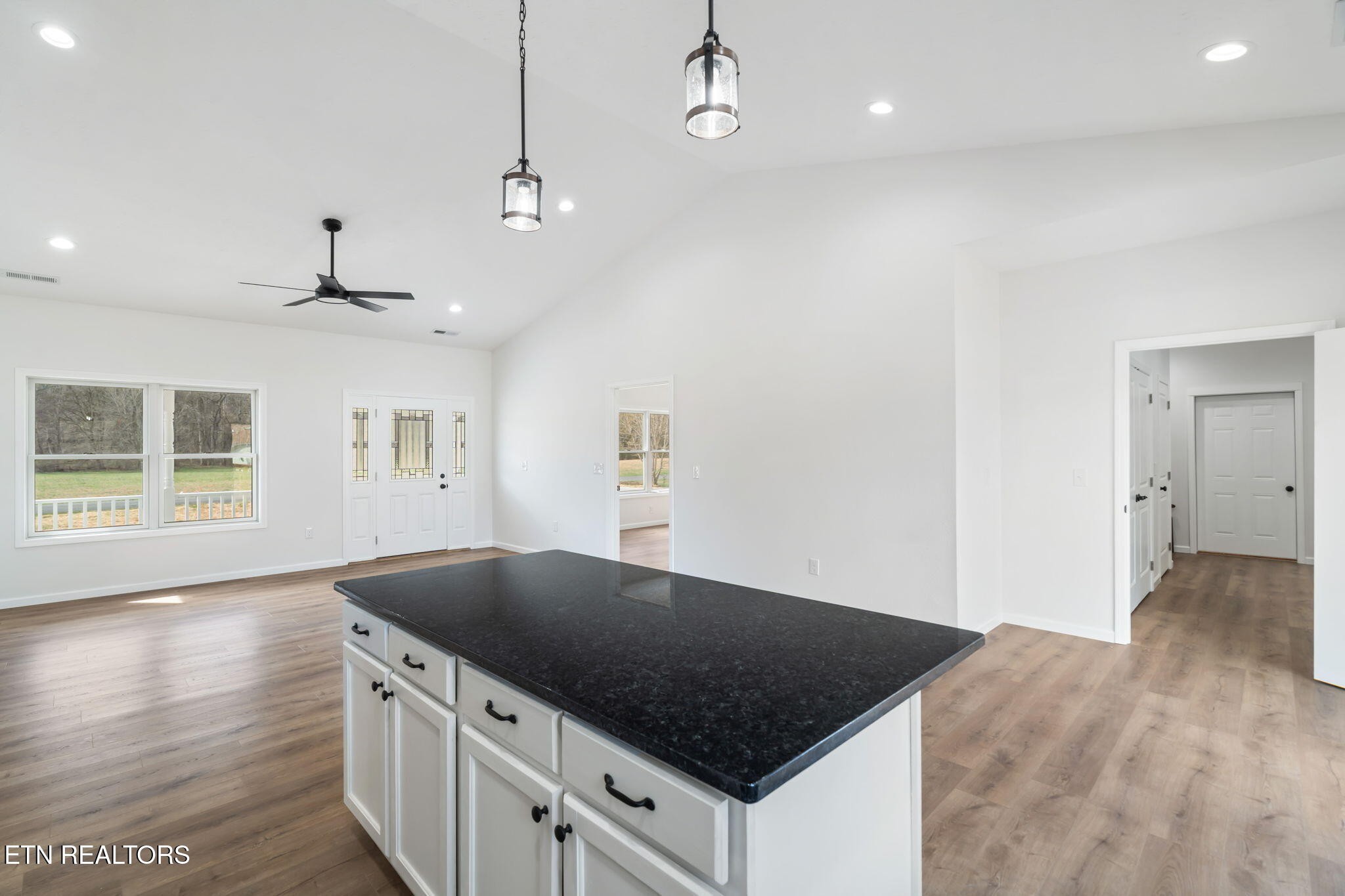 680 Kaylee Lane Del Rio, TN 37727 - Photo 14 of 41 a kitchen with stainless steel appliances granite countertop a sink a stove and a wooden floors