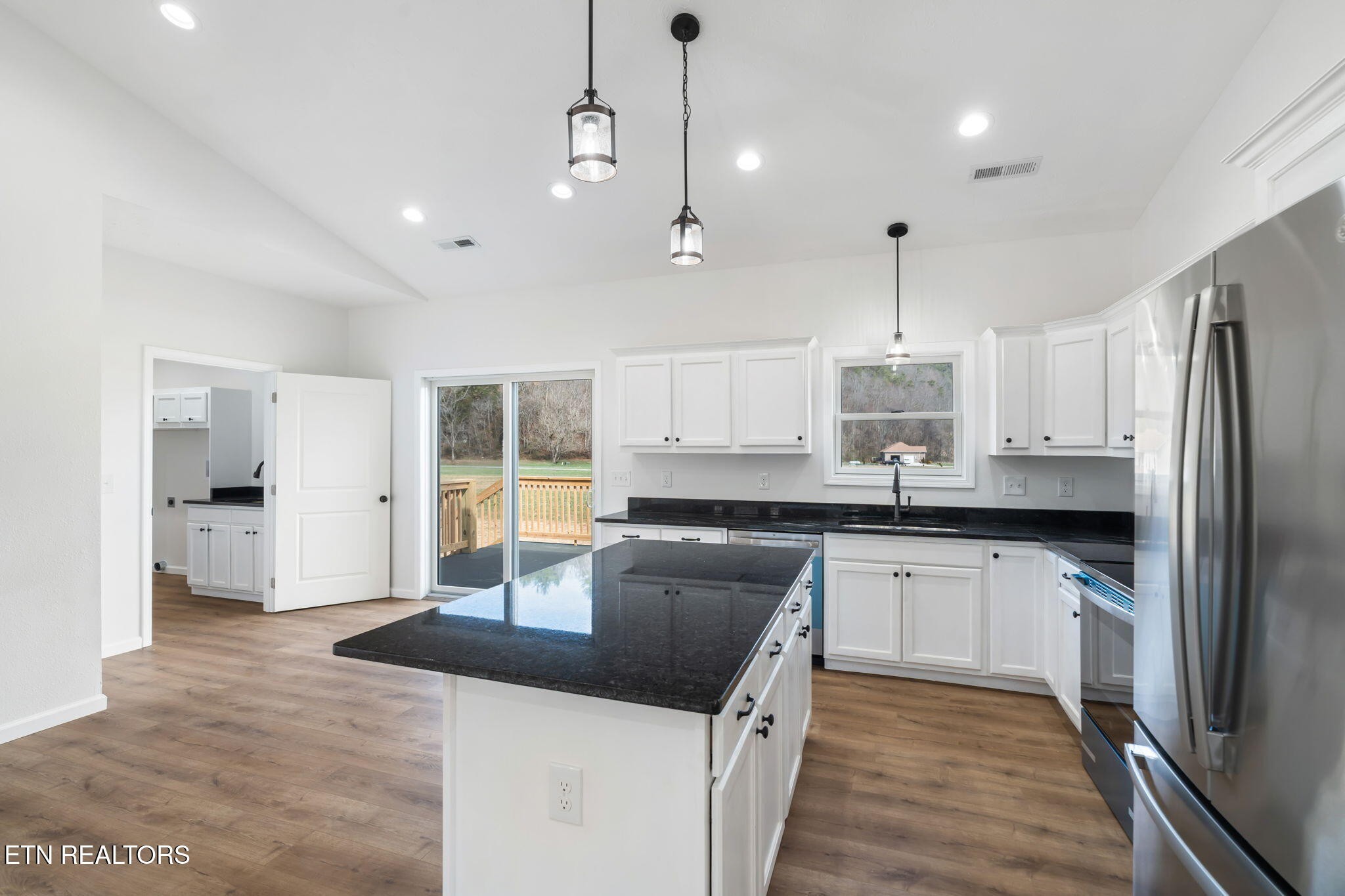 680 Kaylee Lane Del Rio, TN 37727 - Photo 15 of 41 a kitchen with stainless steel appliances granite countertop a sink stove and refrigerator