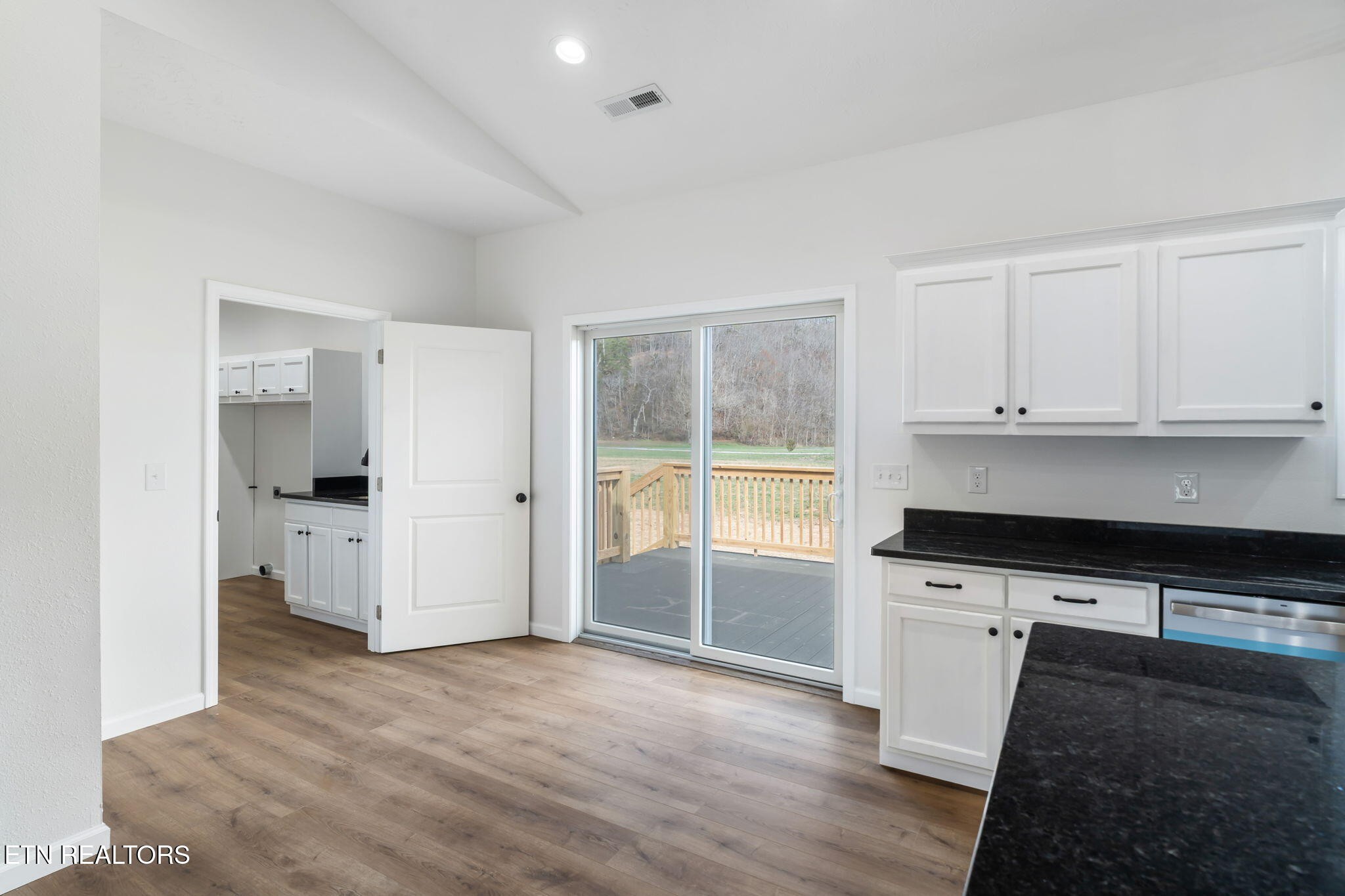 680 Kaylee Lane Del Rio, TN 37727 - Photo 16 of 41 a kitchen with granite countertop a stove and a refrigerator
