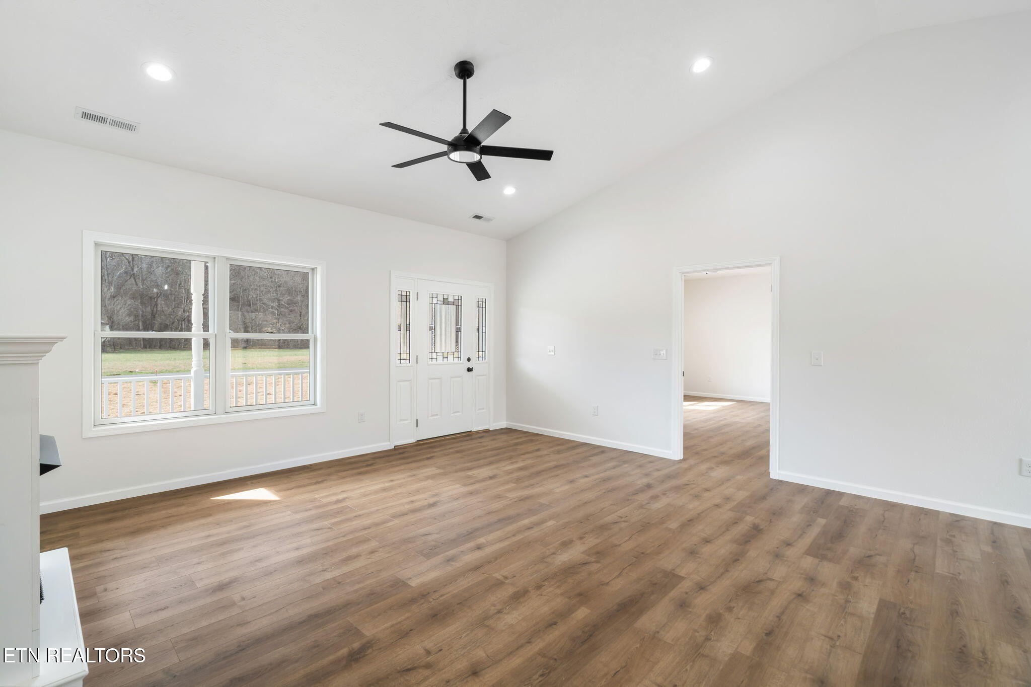 680 Kaylee Lane Del Rio, TN 37727 - Photo 19 of 41 a view of empty room with wooden floor and fan