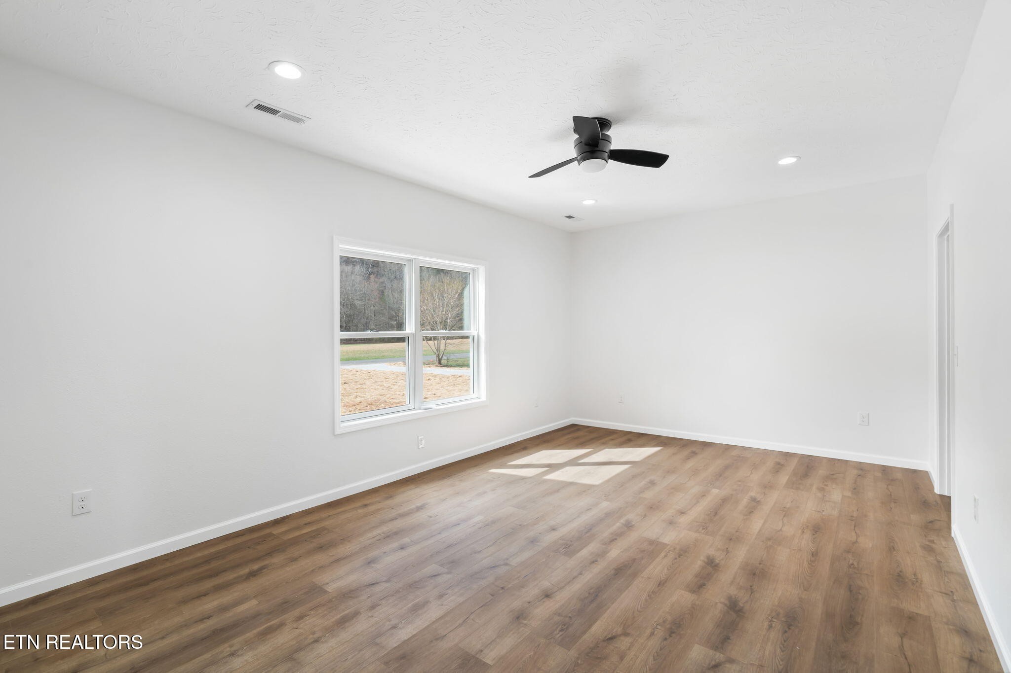 680 Kaylee Lane Del Rio, TN 37727 - Photo 20 of 41 wooden floor in an empty room with a window