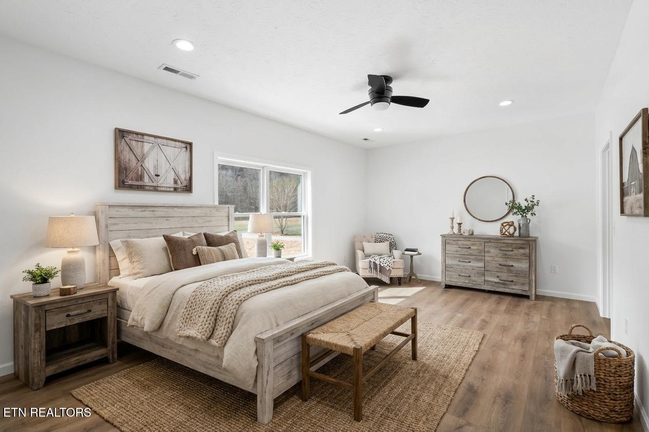 680 Kaylee Lane Del Rio, TN 37727 - Photo 3 of 41 a bedroom with bed and a chandelier