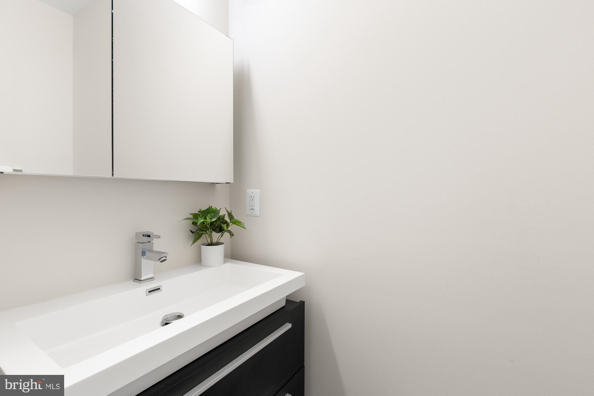 16 Grant Circle Northwest, Unit 2 Washington, DC 20011 - Photo 13 of 35 a bathroom with a sink and cabinets