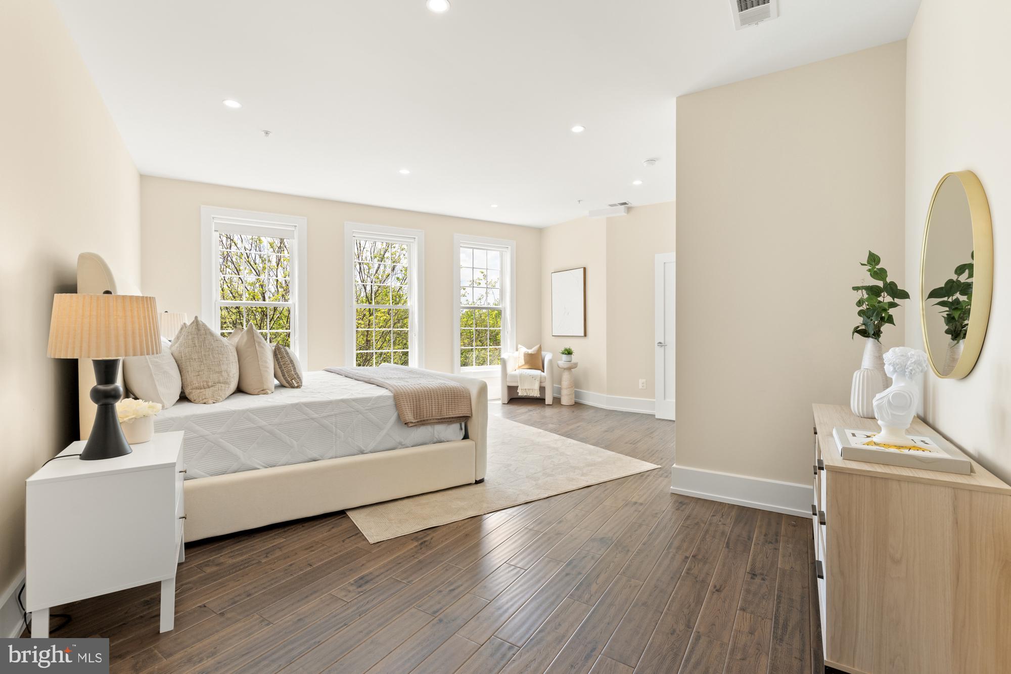 16 Grant Circle Northwest, Unit 2 Washington, DC 20011 - Photo 16 of 35 a living room with furniture a large window and wooden floor