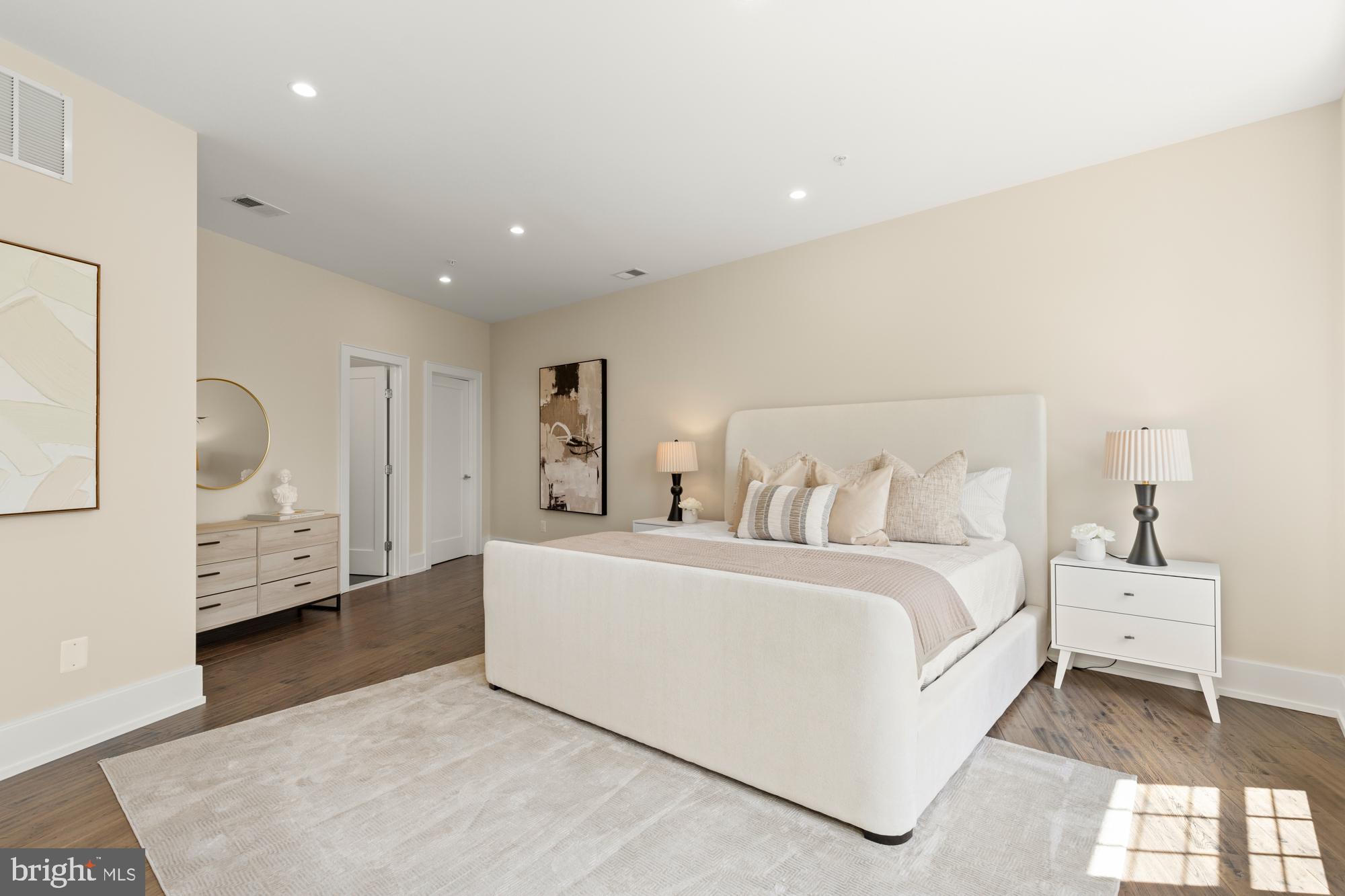 16 Grant Circle Northwest, Unit 2 Washington, DC 20011 - Photo 17 of 35 a room with a bed and a large window