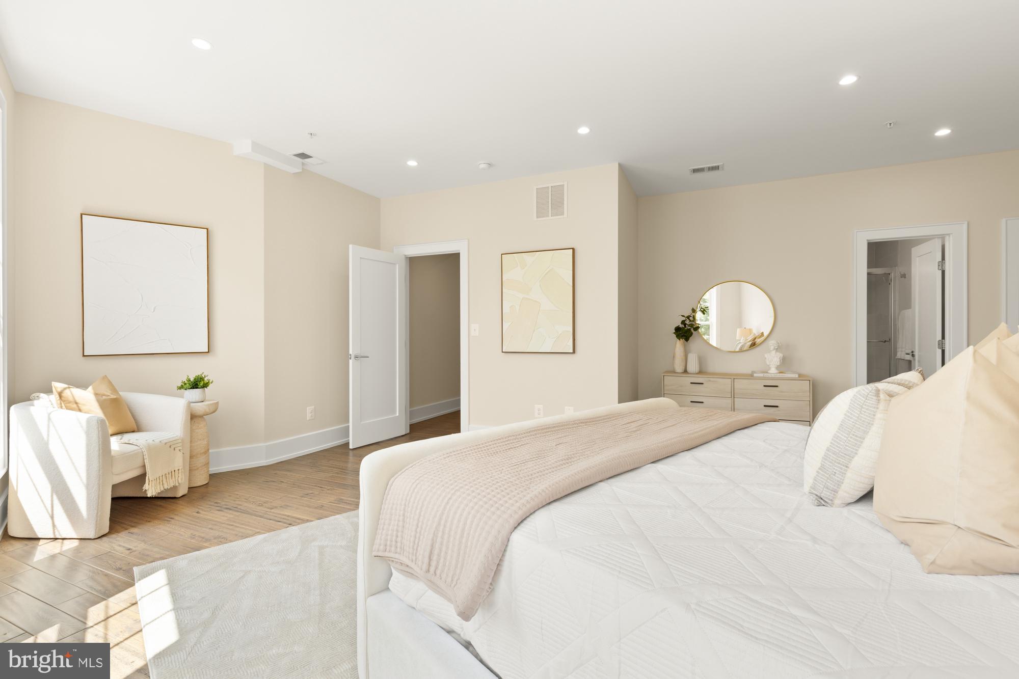 16 Grant Circle Northwest, Unit 2 Washington, DC 20011 - Photo 18 of 35 a bedroom with a bed and wooden floor