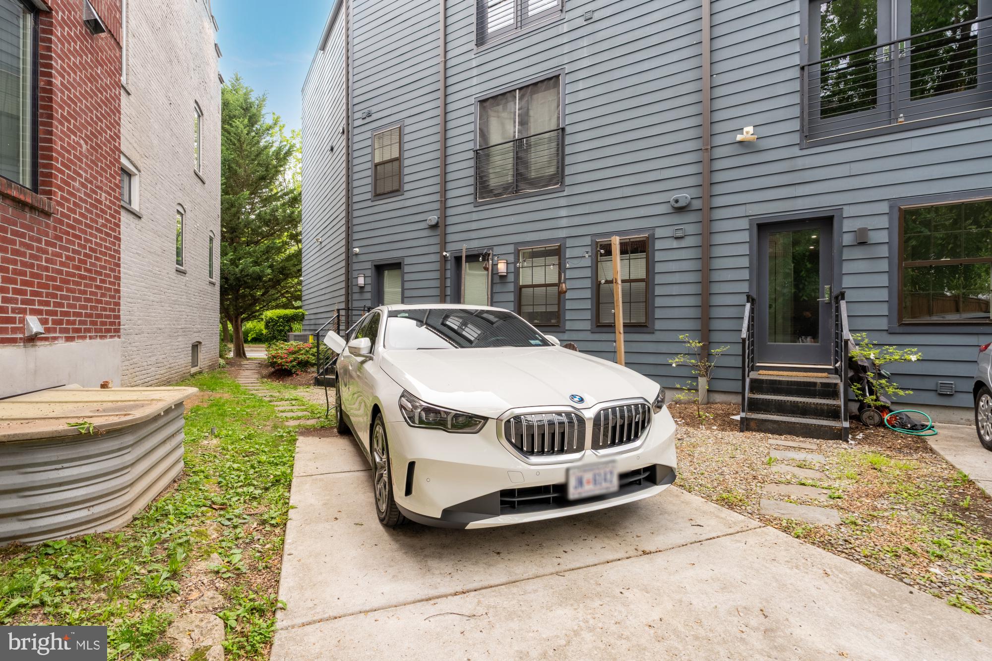 16 Grant Circle Northwest, Unit 2 Washington, DC 20011 - Photo 31 of 35 a car parked in front of a brick house