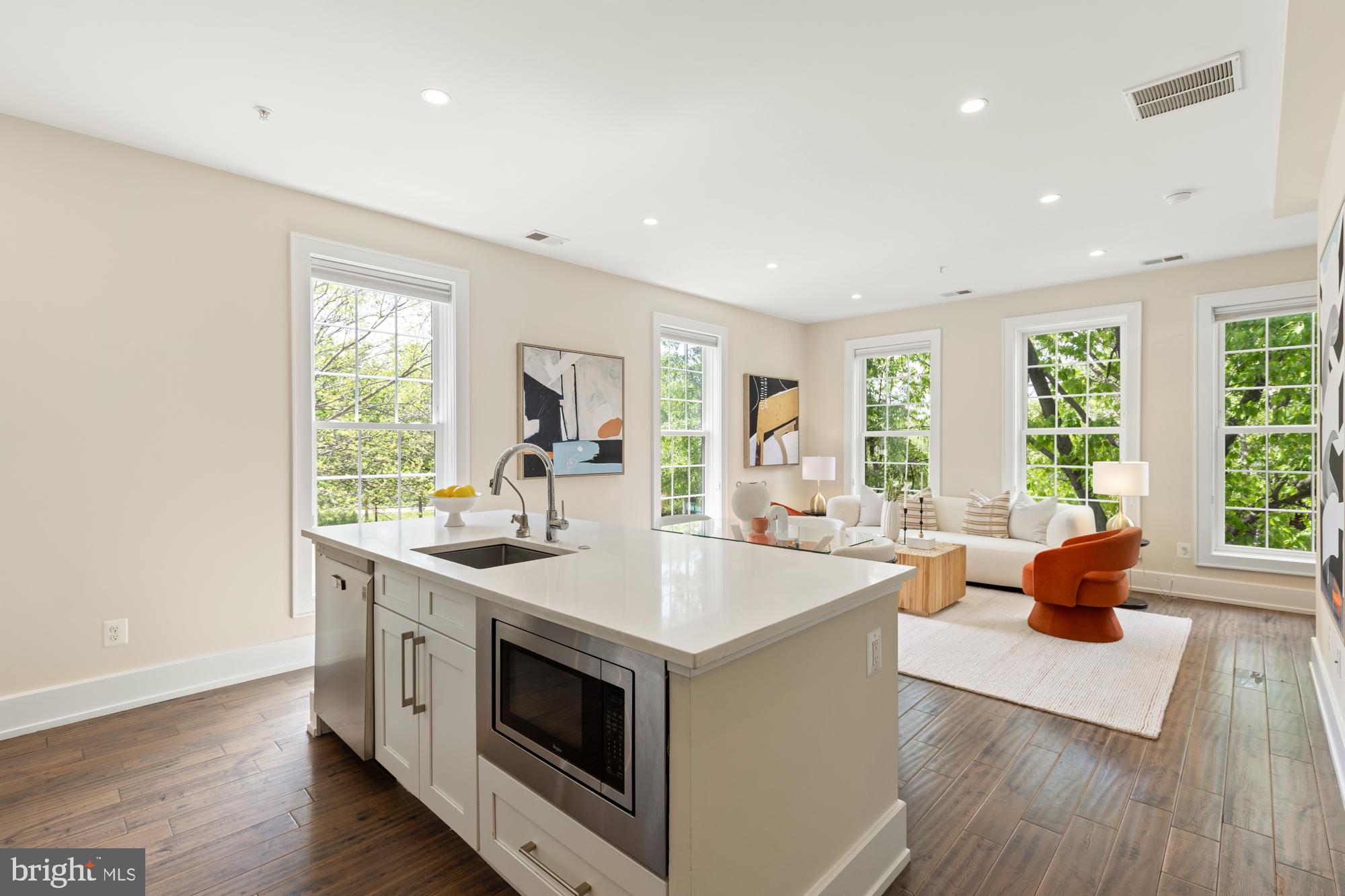 16 Grant Circle Northwest, Unit 2 Washington, DC 20011 - Photo 5 of 35 a view of a kitchen counter top space and living room