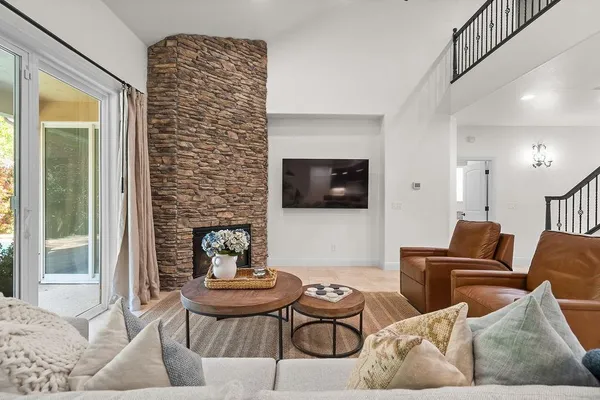 a bedroom with a bed and a couch