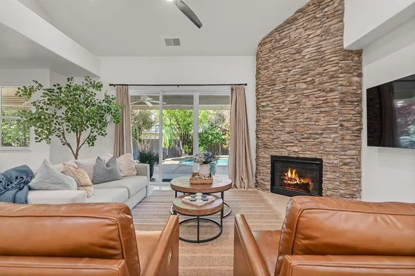 a living room with furniture and a large window