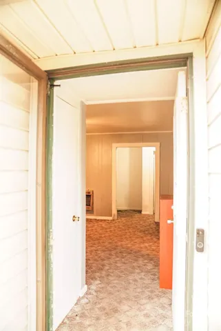a view of a big room with wooden door