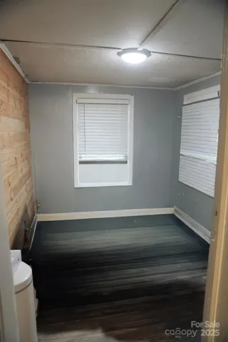 a room with a bed and a window