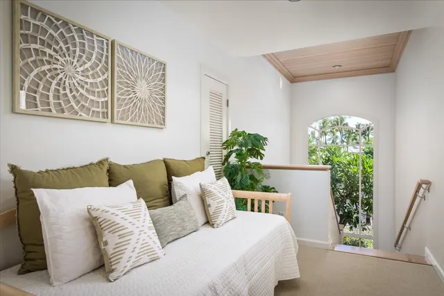 a living room with furniture and flowers