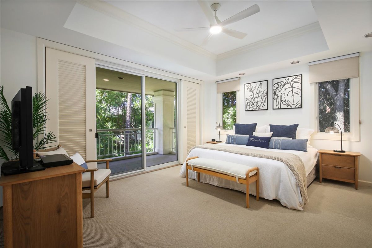 68-1375 Pauoa Road, Unit D4 Kamuela, HI 96743 - Photo 20 of 30 a spacious bedroom with a large bed and a flat tv screen