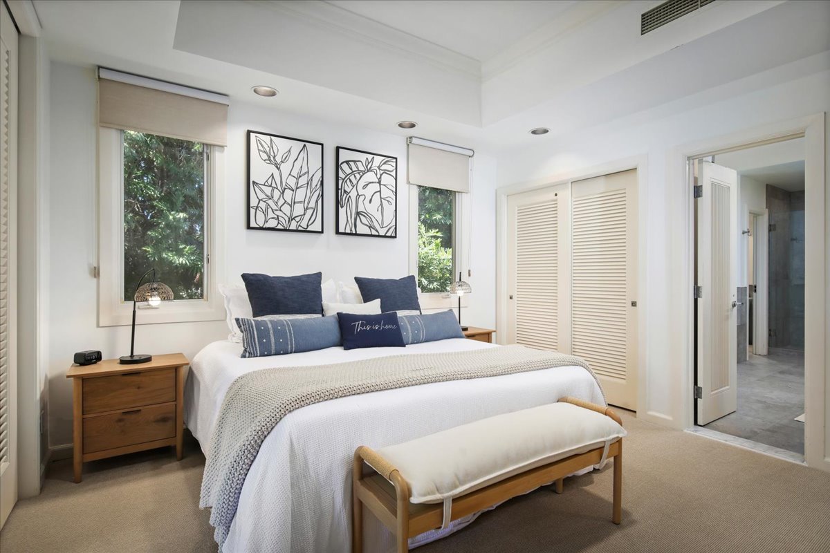 68-1375 Pauoa Road, Unit D4 Kamuela, HI 96743 - Photo 22 of 30 a bedroom with bed and a couch