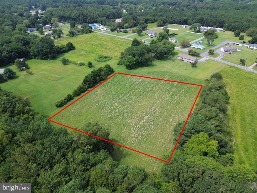 an aerial view of a golf course with parking space