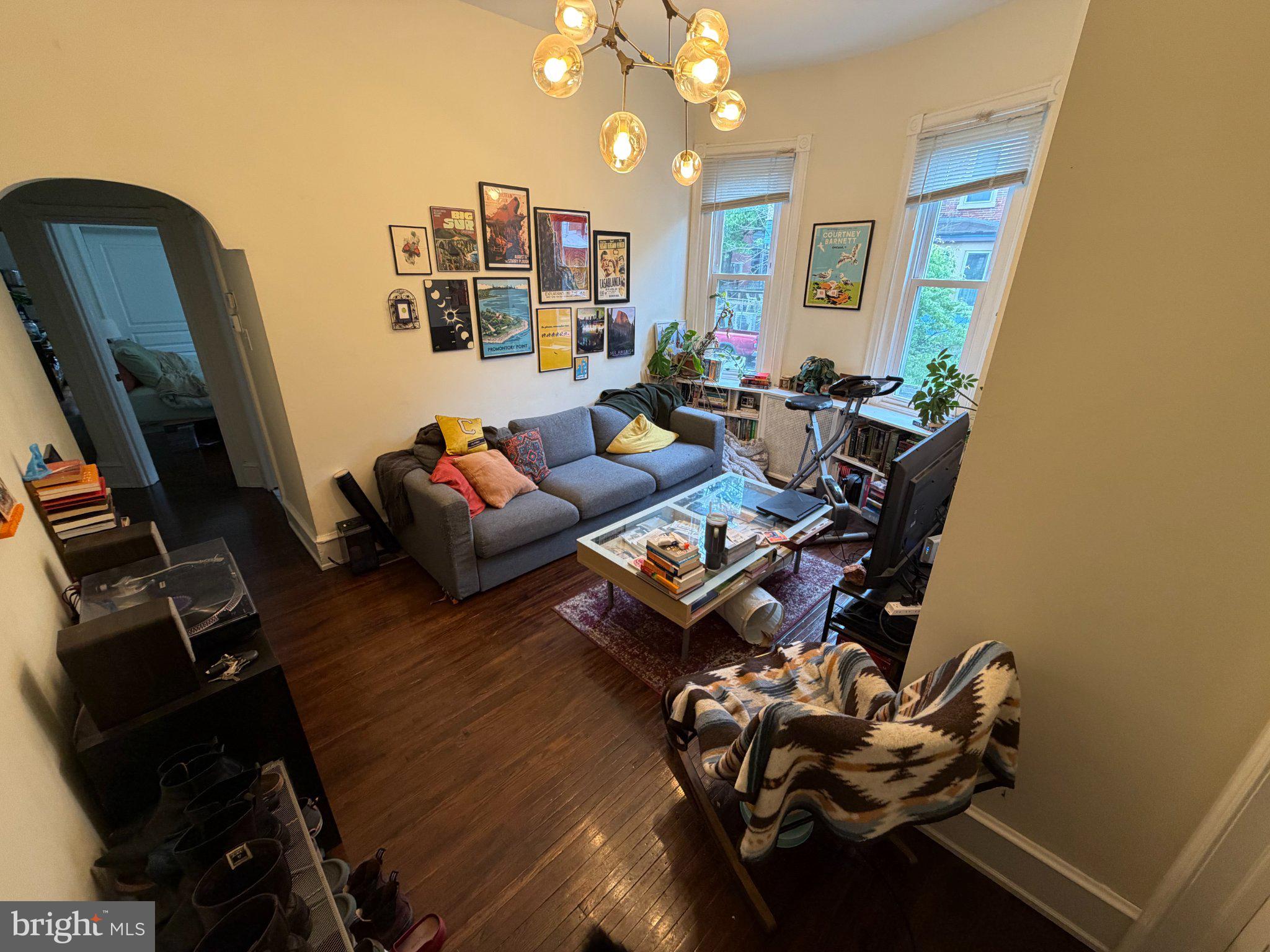 815 South 49th Street Philadelphia, PA 19143 - Photo 7 of 72 a living room with furniture and a chandelier
