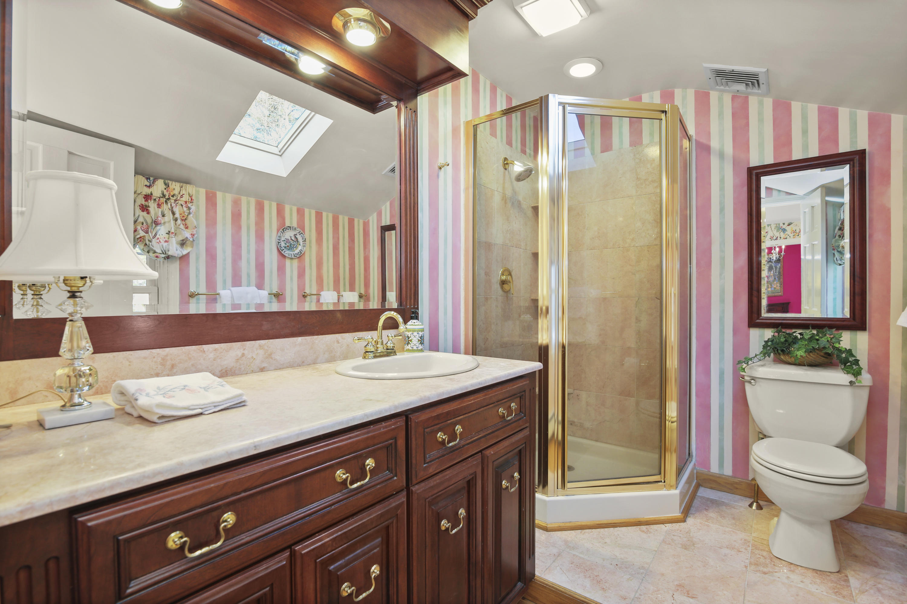 6 Echo Drive Darien, CT 06820 - Photo 18 of 37 a bathroom with a granite countertop sink toilet and shower