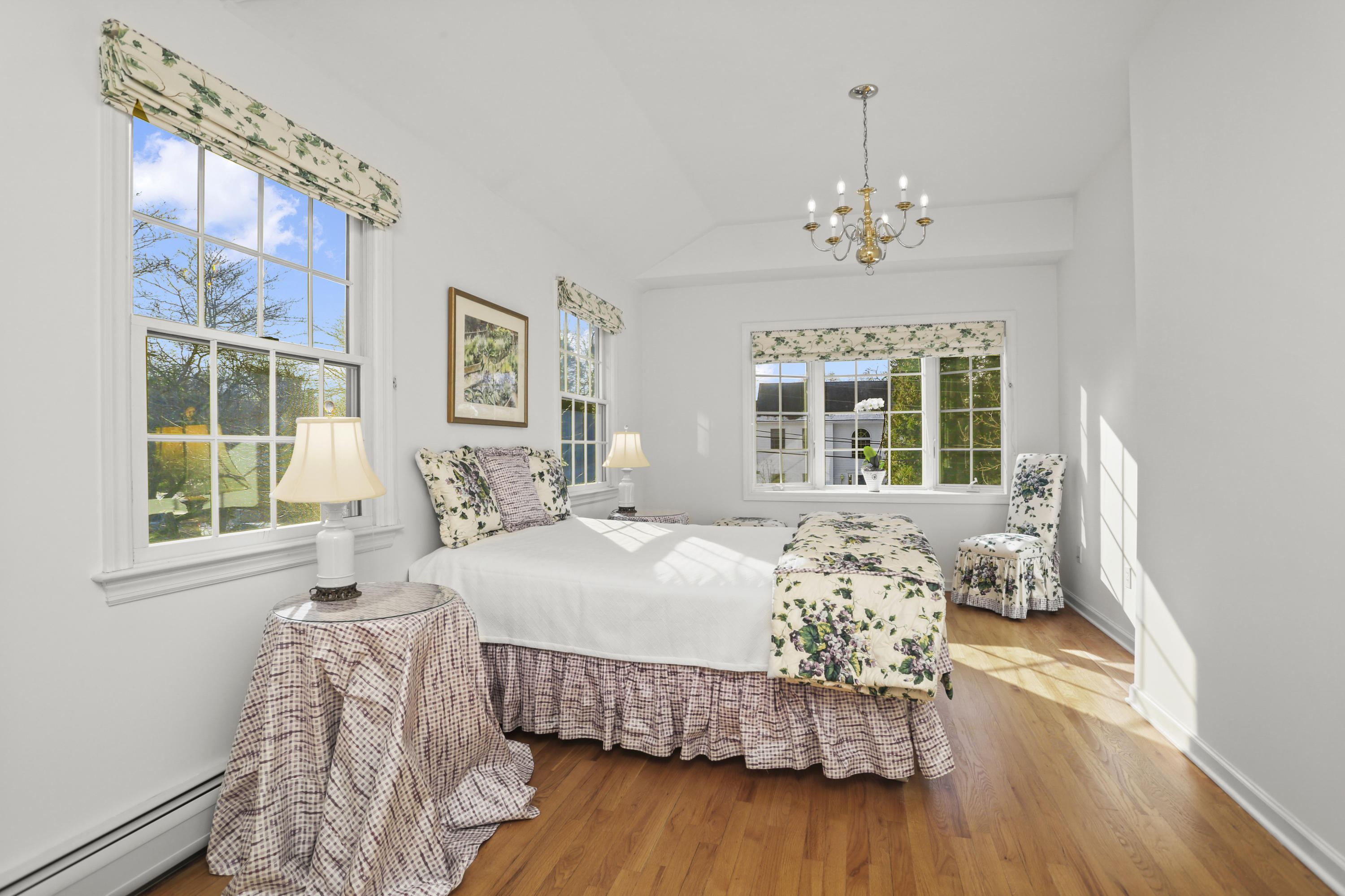 6 Echo Drive Darien, CT 06820 - Photo 20 of 37 a bedroom with a bed chandelier and a window