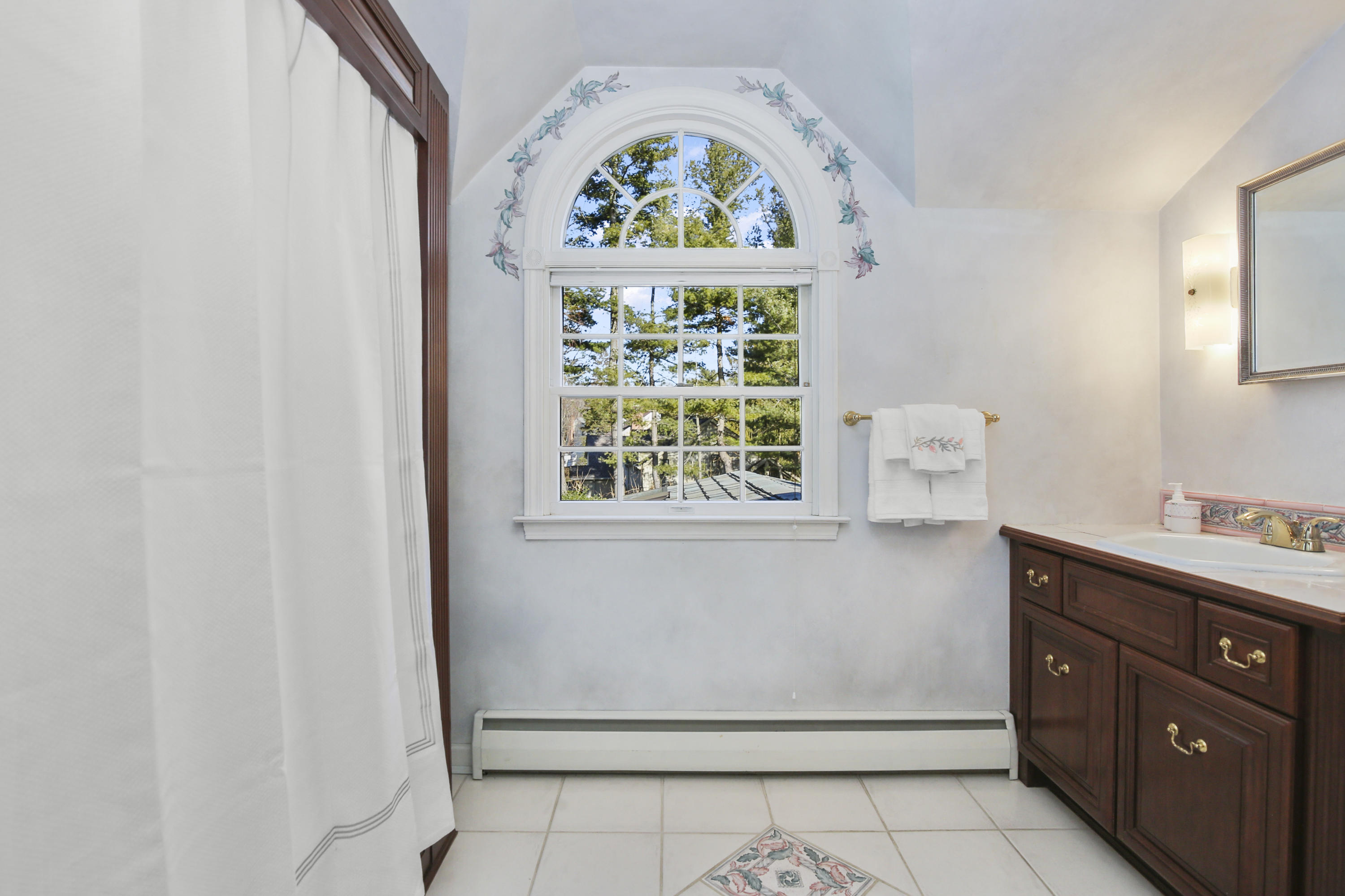 6 Echo Drive Darien, CT 06820 - Photo 22 of 37 a bathroom with a stove a sink and a window