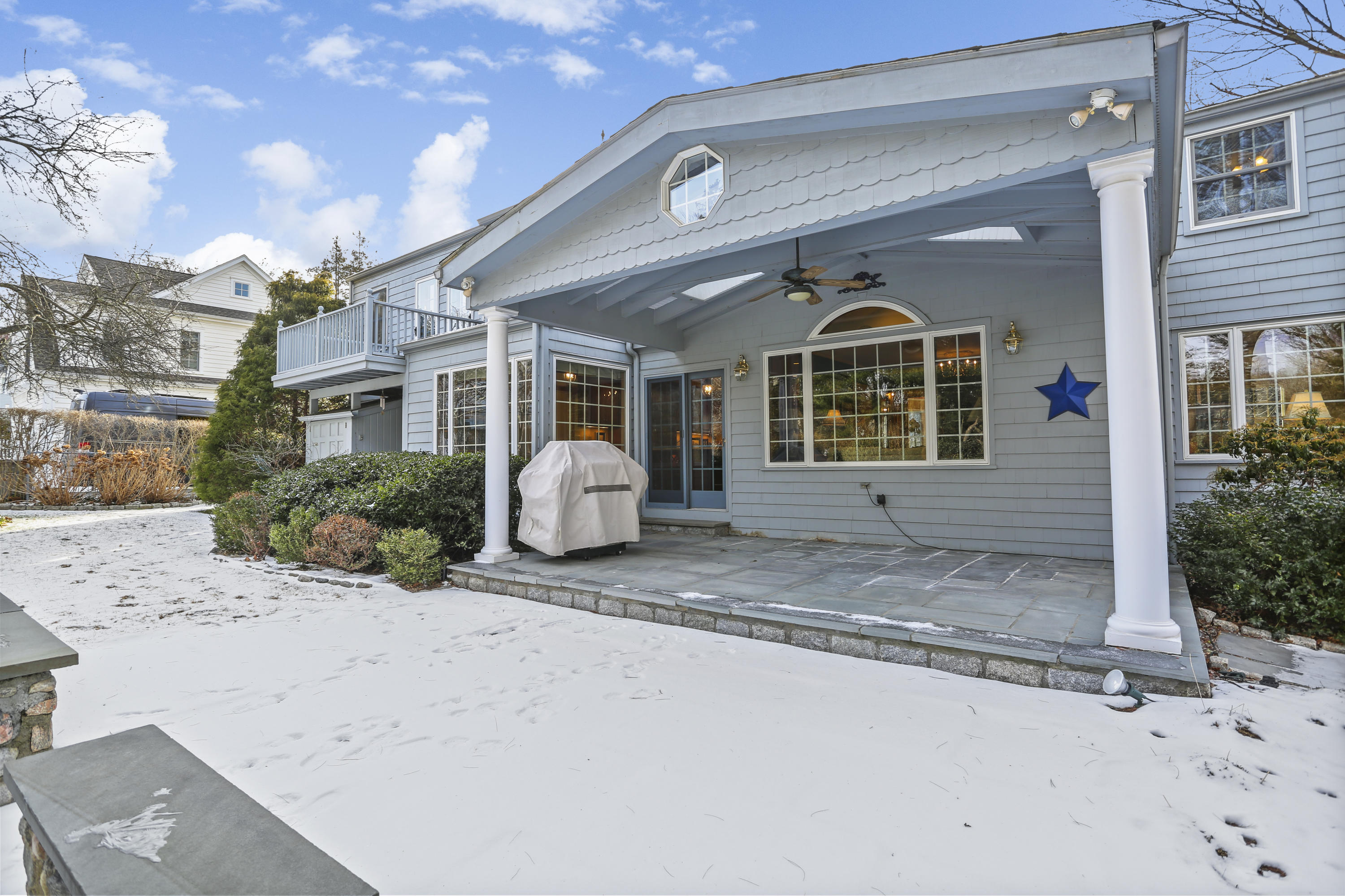 6 Echo Drive Darien, CT 06820 - Photo 27 of 37 a front view of a house with a garden and plants