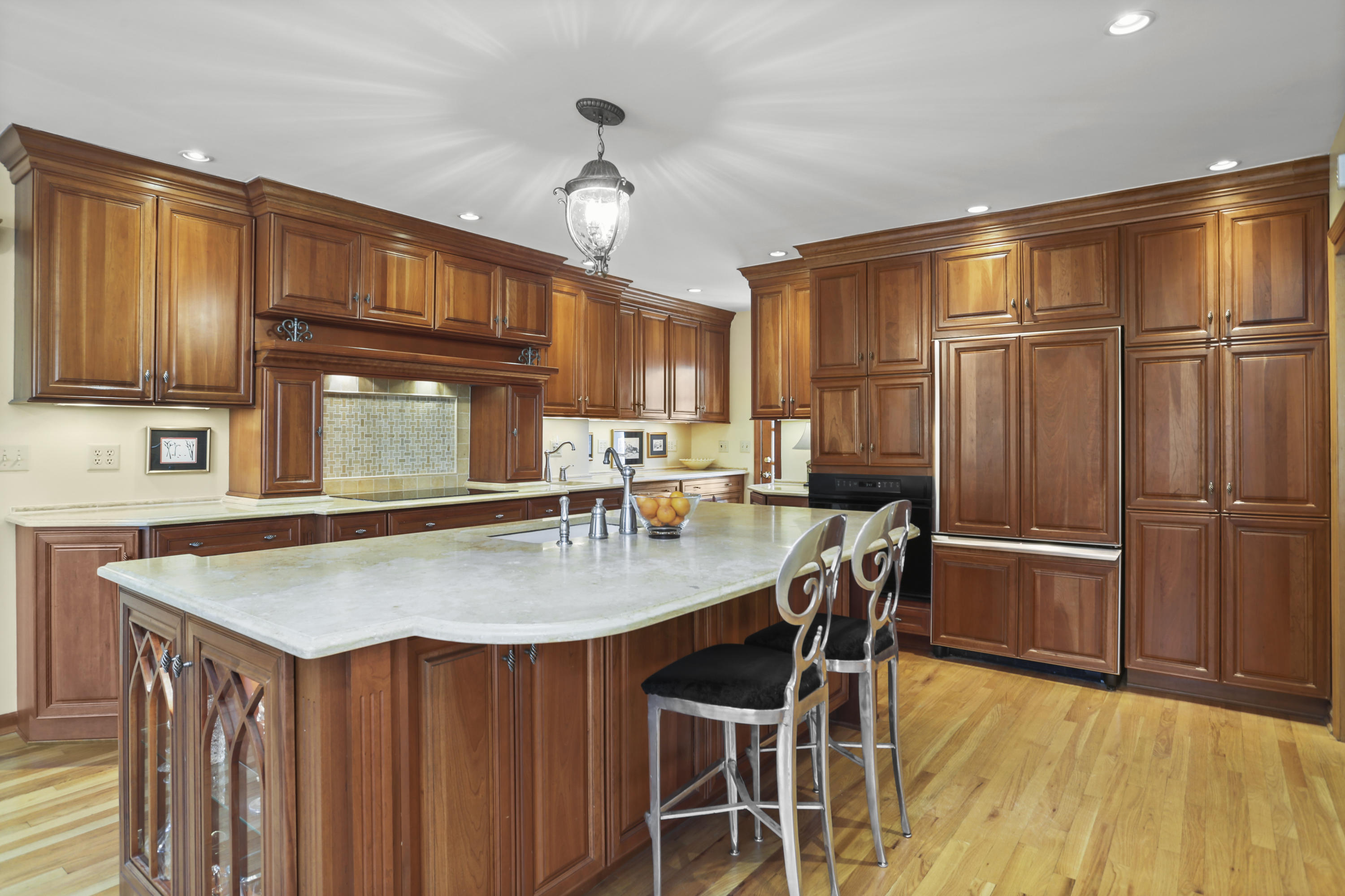 6 Echo Drive Darien, CT 06820 - Photo 8 of 37 a kitchen with stainless steel appliances granite countertop a table chairs sink and cabinets