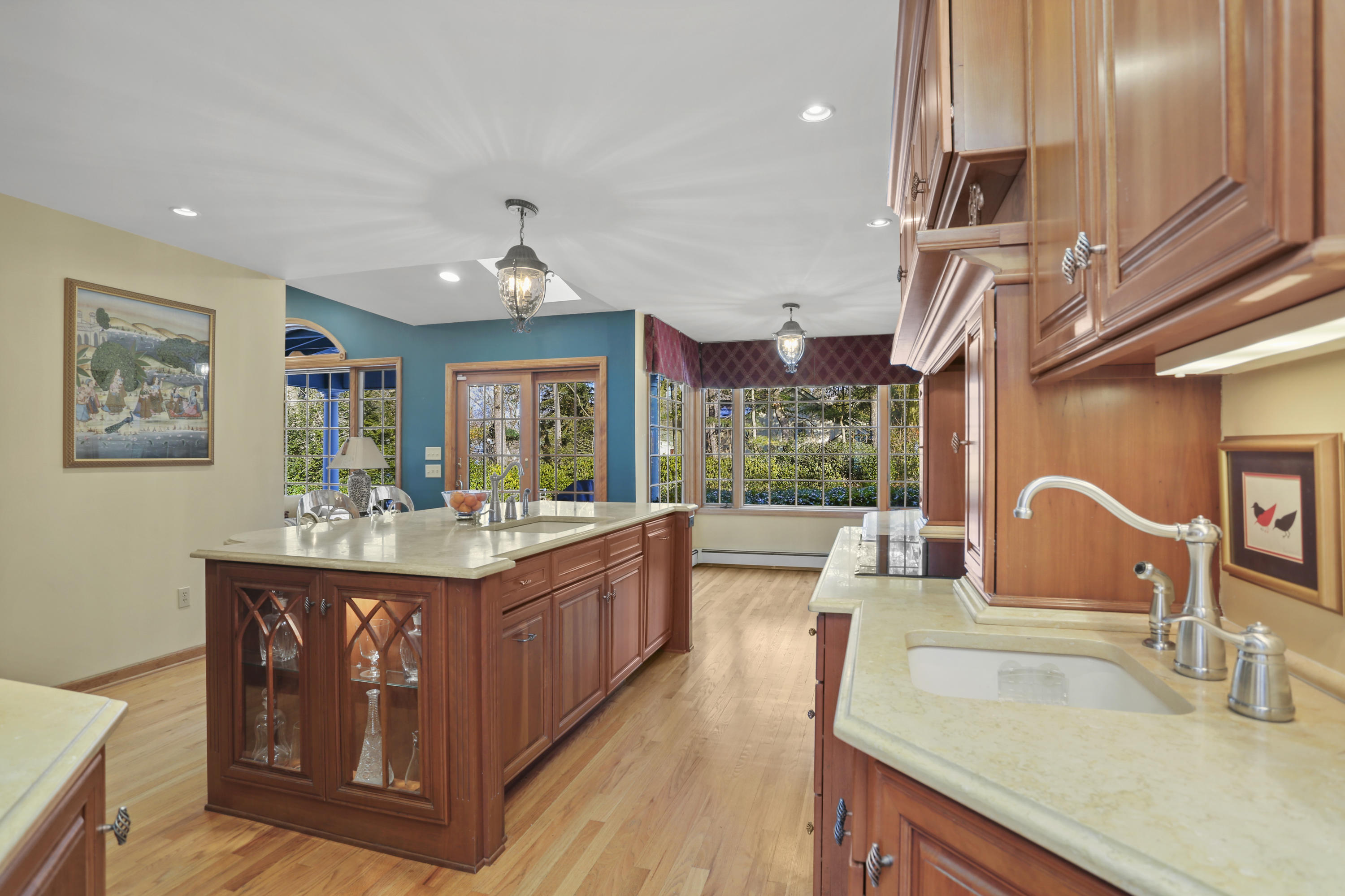 6 Echo Drive Darien, CT 06820 - Photo 9 of 37 a large kitchen with kitchen island a large counter space a sink stainless steel appliances and cabinets