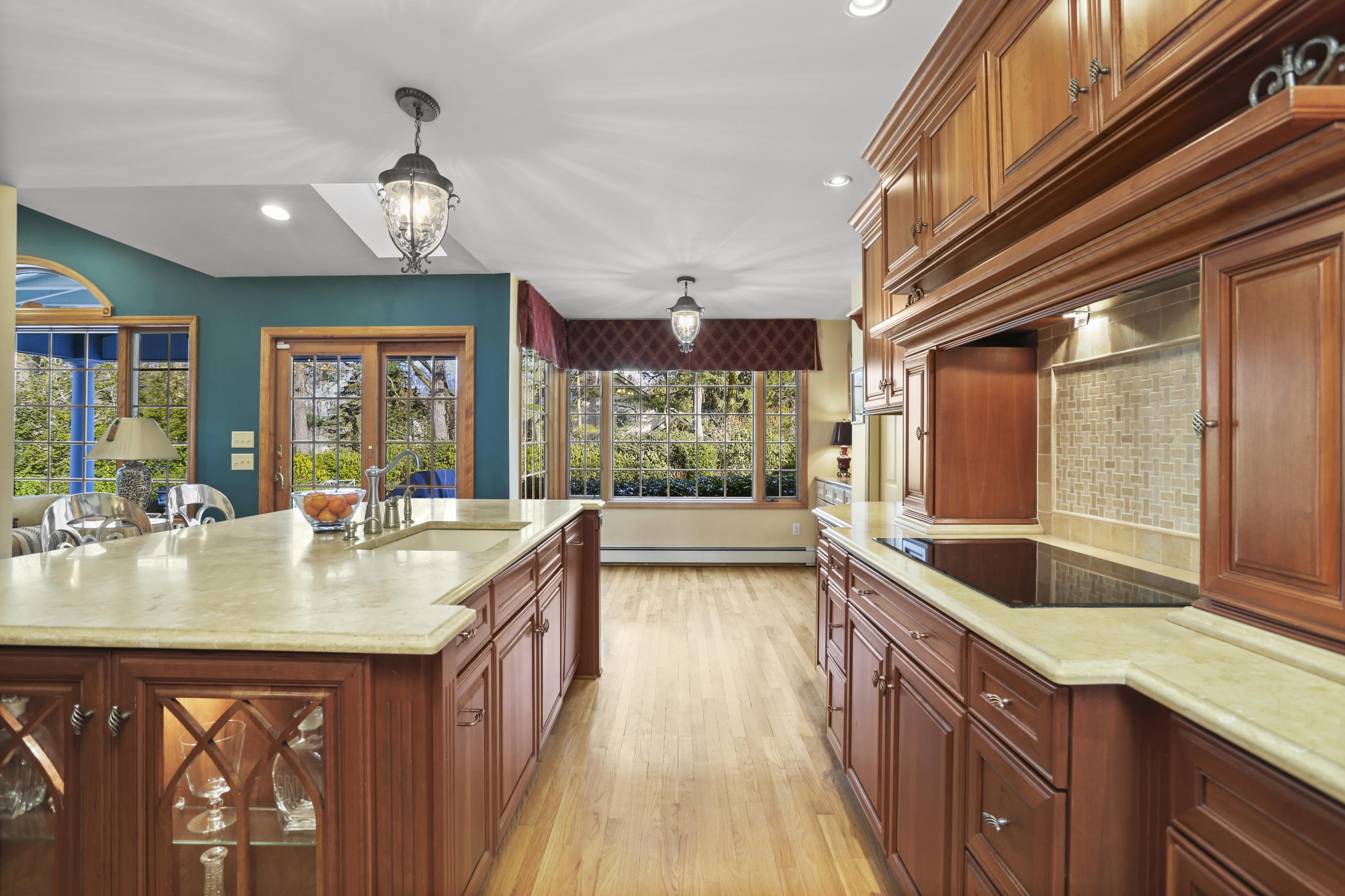 6 Echo Drive Darien, CT 06820 - Photo 10 of 37 a kitchen with a stove a sink and wooden cabinets