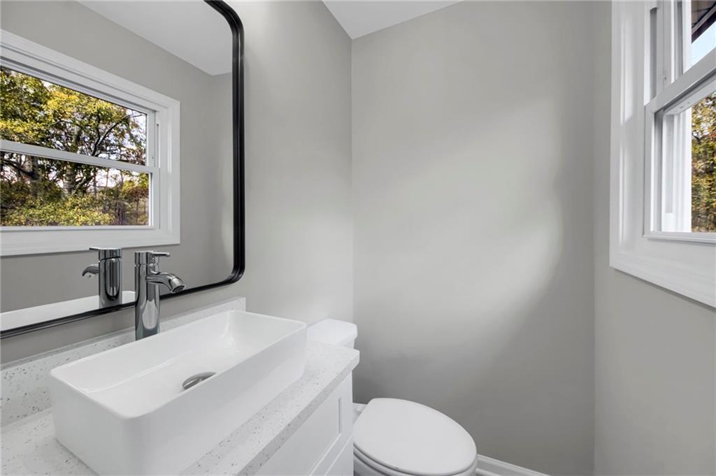 24 Echo Ridge Drive Powder Springs, GA 30127 - Photo 11 of 28 a bathroom with a sink toilet and window