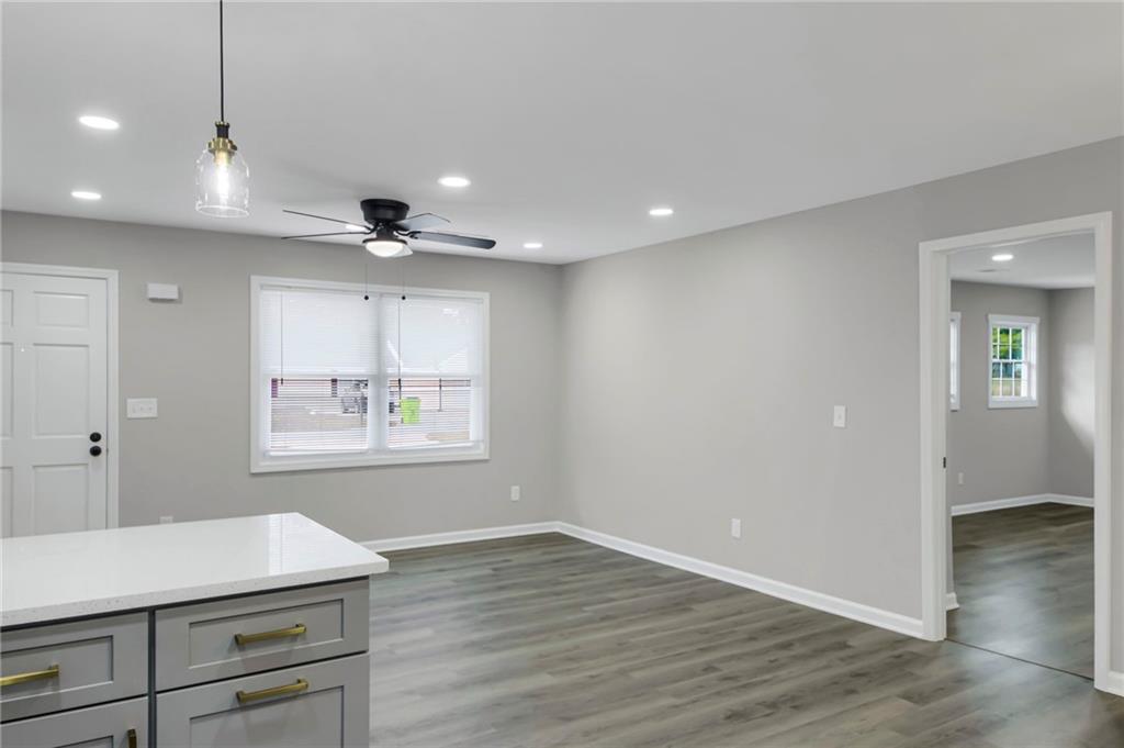 24 Echo Ridge Drive Powder Springs, GA 30127 - Photo 19 of 28 an empty room with wooden floor and windows