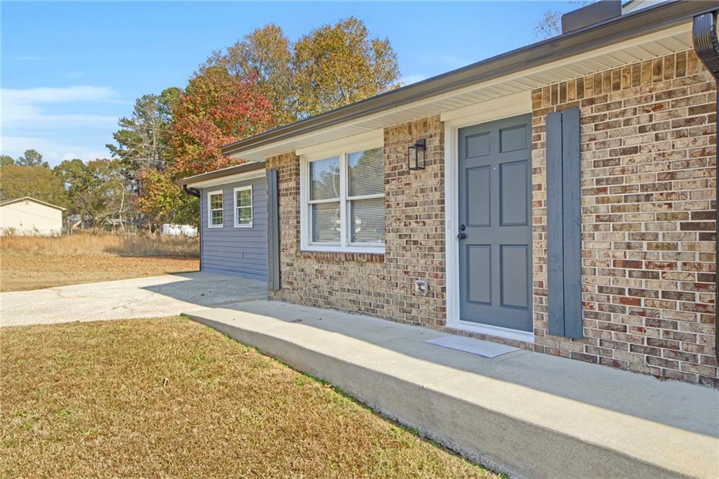 24 Echo Ridge Drive Powder Springs, GA 30127 - Photo 2 of 28 a view of a house with a street