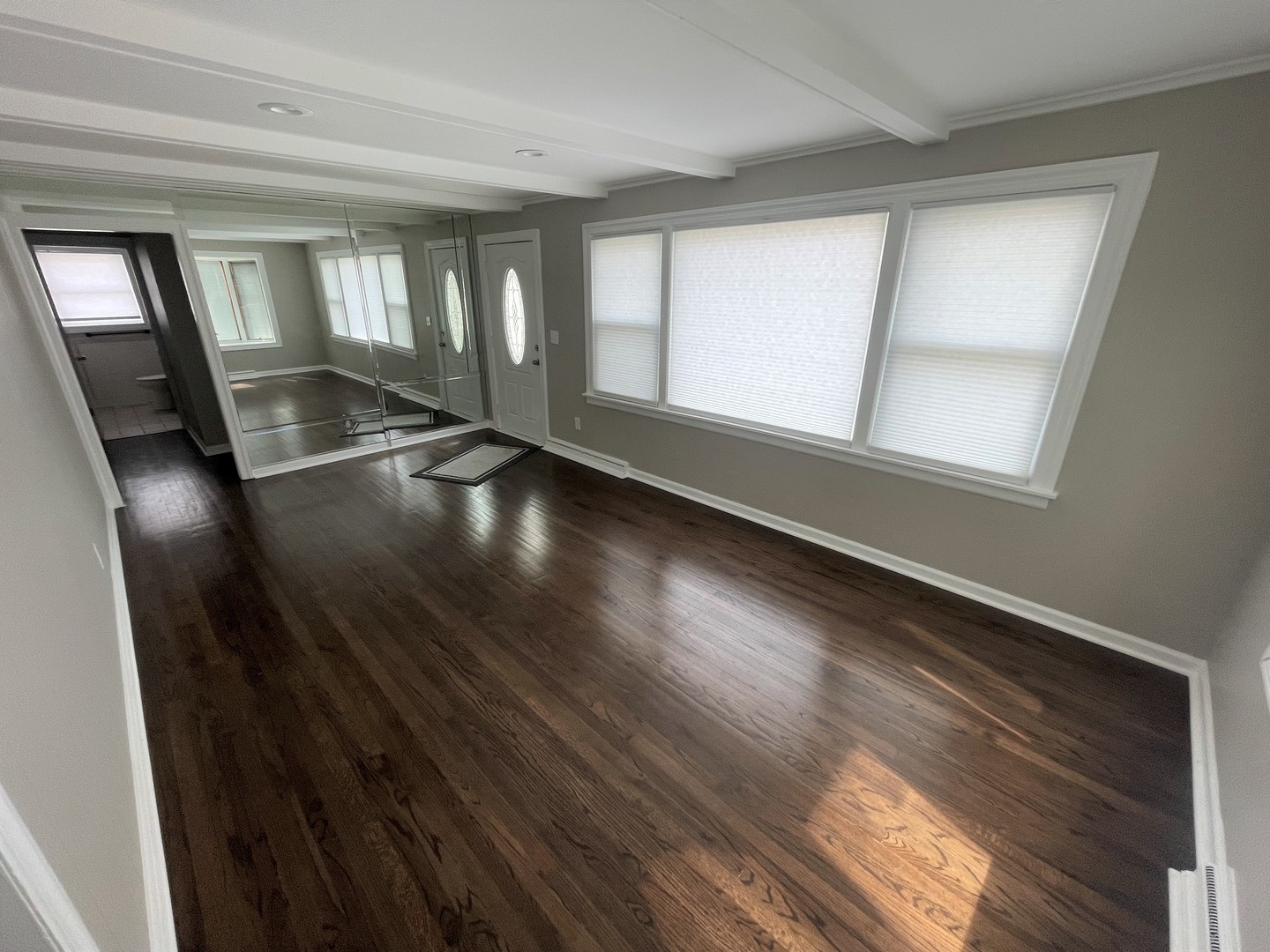 228 South Quentin Road Palatine, IL 60067 - Photo 3 of 14 wooden floor in an empty room with a window