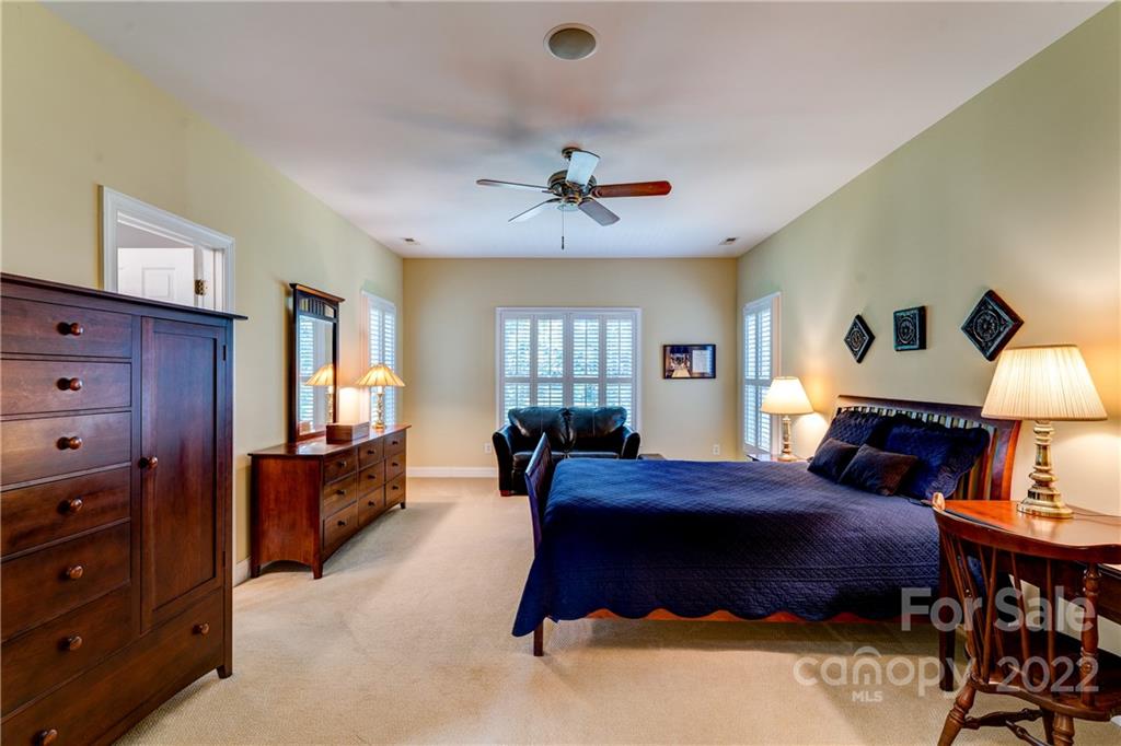 1944 Clark Elliot Street Fort Mill, SC 29708 - Photo 27 of 46 a bedroom with a bed and wooden floor