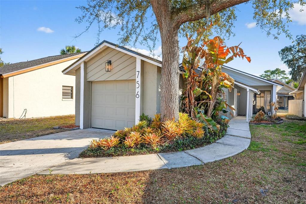 756 Dunlap Circle Winter Springs, FL 32708 - Photo 1 of 1 a front view of a house with garden