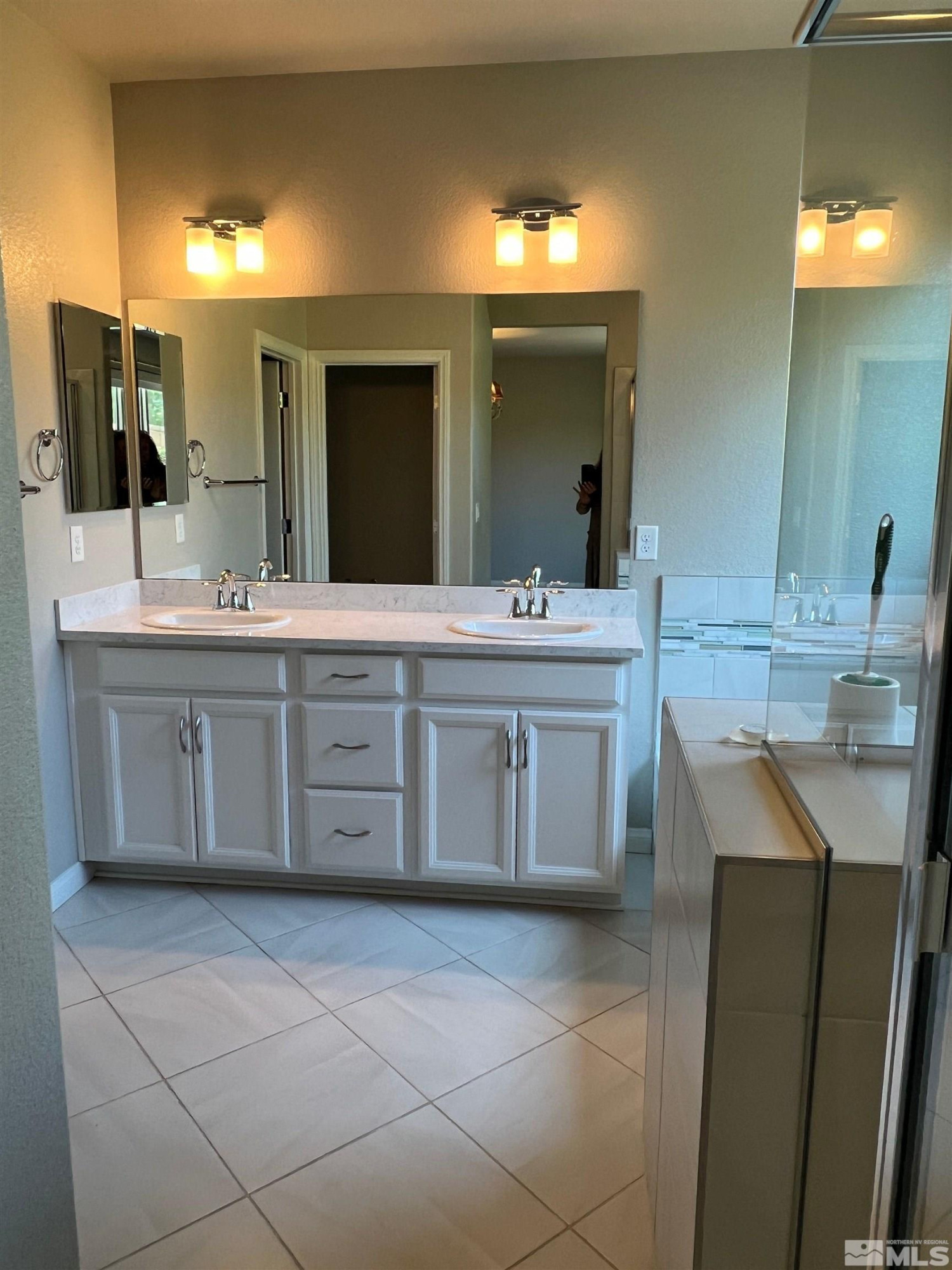 774 Sweet Briar Lane Sparks, NV 89436 - Photo 11 of 17 a bathroom with a sink vanity and mirror