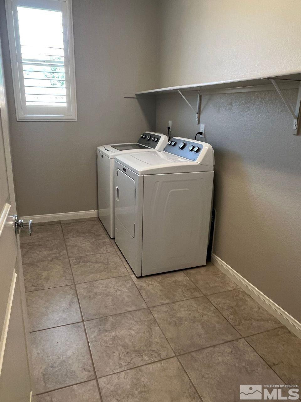 774 Sweet Briar Lane Sparks, NV 89436 - Photo 15 of 17 a utility room with a washer dryer and a counter