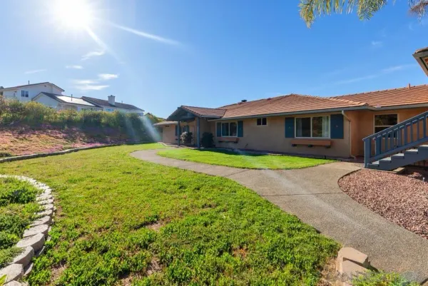 a view of a house with a big yard
