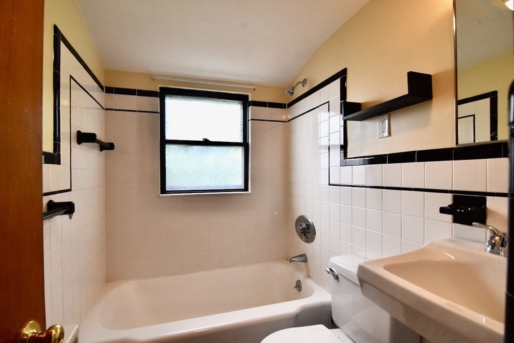 20 Hollis Avenue, Unit 5 Quincy, MA 02171 - Photo 9 of 14 a bathroom with a bathtub and a shower